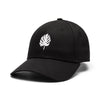 a black cap with a white monstera leaf logo on a white background