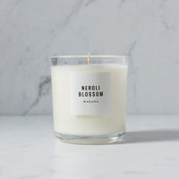 A Neroli Blossom Classic Candle - NO PACKAGING made by Makana, with soy wax and scented with a citrus floral fragrance reminiscent of orange groves.